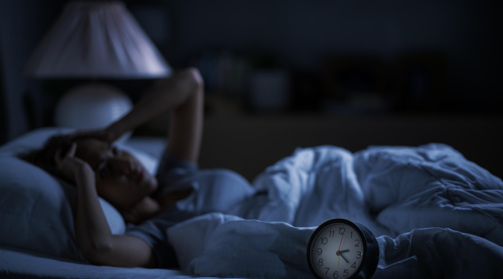 A women with sleep insomnia in bed